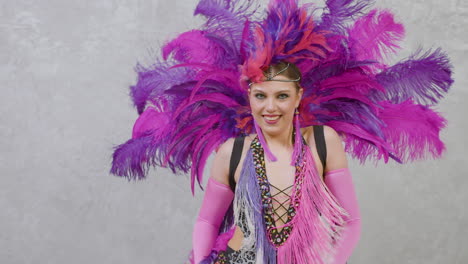 female dancer in a feather outfit performing a cabaret dance