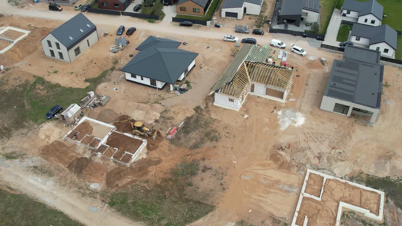 Drone flying forward over a residential construction site in Vilnius, Lithuania