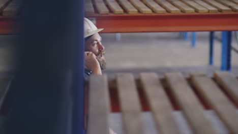 a man talking on his cellphone while working