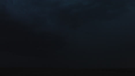 dark stormy night sky with heavy clouds