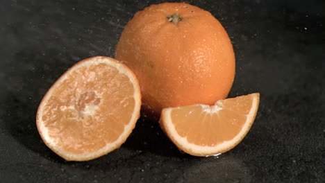 Water-falling-on-oranges-in-super-slow-motion