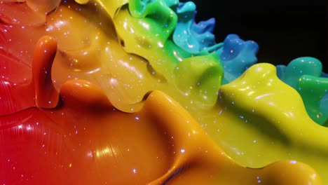 smooth abstract animation of liquid gradient rainbow color in 4k. bright glossy paint surface as abstract looped festive background. glitters on viscous liquid with 3d splashes on surface like drops.