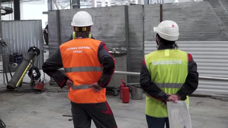 factory workers inspecting industrial site