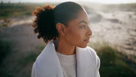 Dreamy-girl-close-eyes-enjoying-breeze-closeup.-Calm-black-hair-model-looking