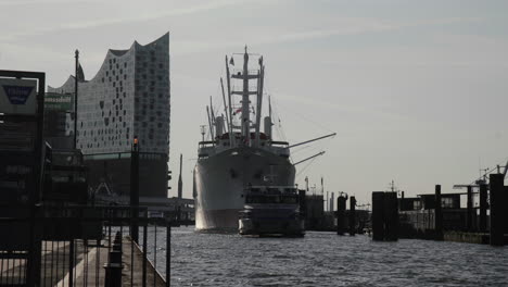 elbphilharmonie and cap san diego view from hamburg landungsbrücken early in the morning