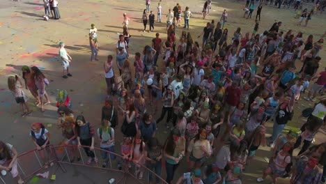 festival of color in a city park. vinnitsa, ukraine - july 2017: people have fun during the festival of color in a city park in vinnitsa
