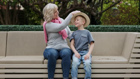 grandmother and grandson spending time together in the garden