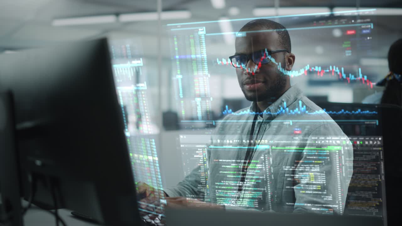 Futuristic Office with Hologram Screens Concept: Portrait of Professional Black IT Specialist Working on Desktop Computer with Holographic Projection Showing Stock Market Information, Big Data, Charts