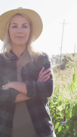 video of happy caucasian woman standing in field on sunny day