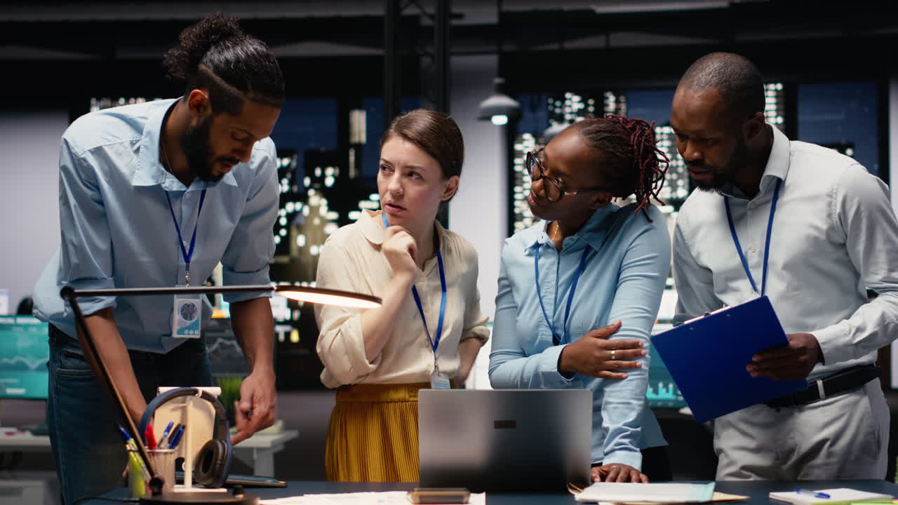 Diverse men and women working together on project in corporate space