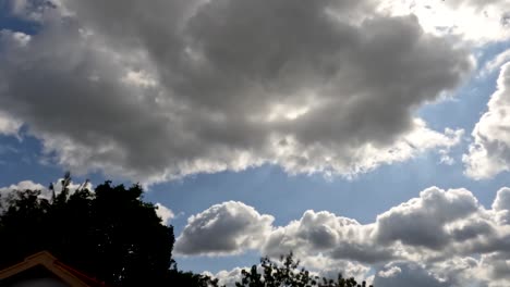 time lapse of the movement of white clouds in a blue sky, weather changing from sunny to slightly cloudy