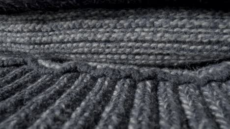 close-up of knitted grey and white fabric texture