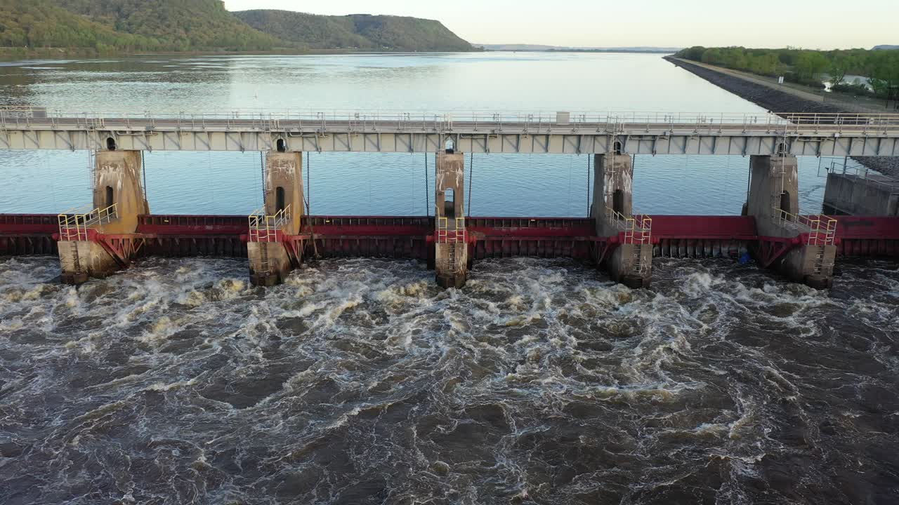 River Dam with Water Flowing Through Spillways
