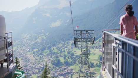 Girl,-staring,-valley,-mountains,-ski-lift,-Switzerland