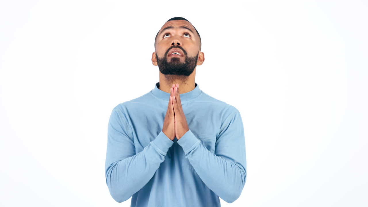 Hands, man and praying in studio with anxiety