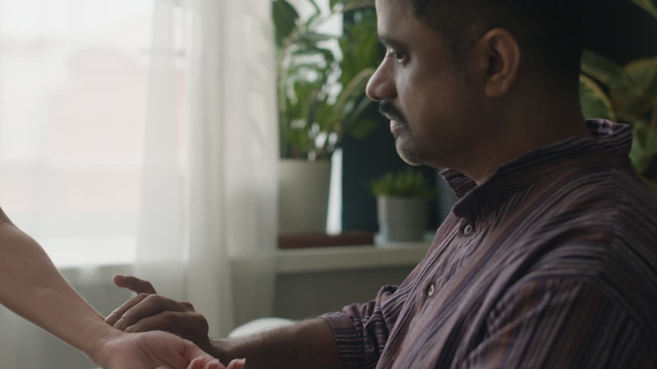Doctor checking patient's pulse