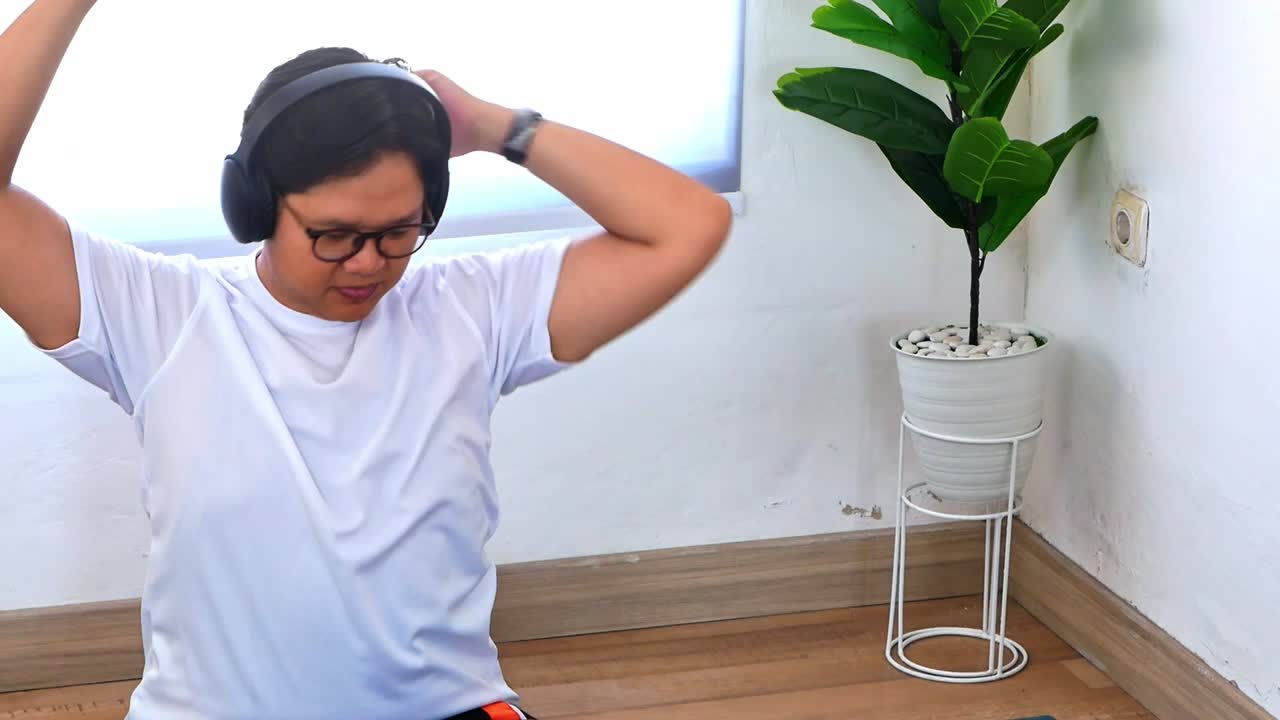 Energetic young man stretching and listening to music with headphones promoting active lifestyle