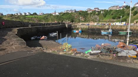 fishing boat entering crail harbour in fife scotland