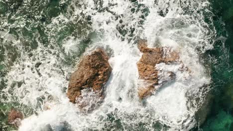 aerial high angle zoom out shot of beautiful turquoise water near rampla beach on the island gozo, malta