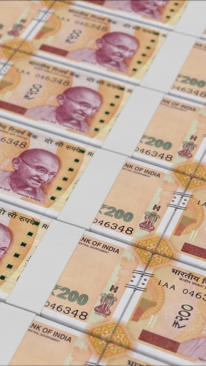 Vertical video of 200 RUPEES banknotes printing by a money press