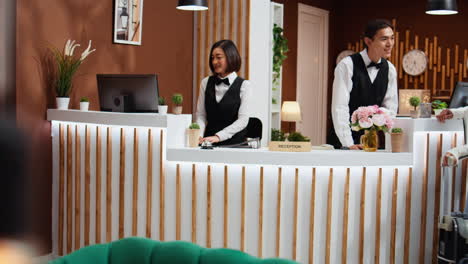 hotel guest arriving at reception to do check in process