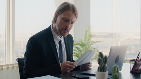 businessman reviewing documents in an office