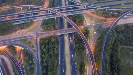 arcs and bends of multi-lane ramps and interchanges between m4 and m7 motorways in western sydney viewed top down from above