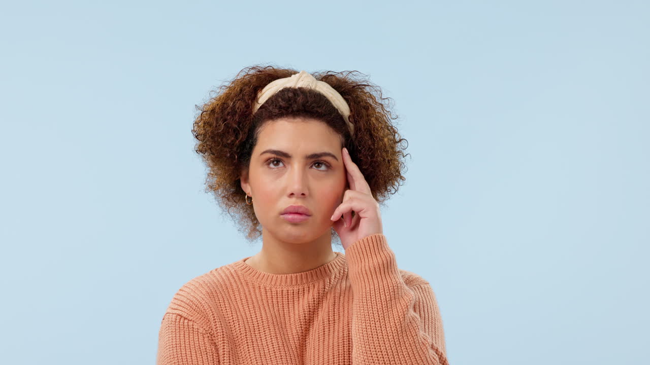 Thinking, idea and face of woman in studio