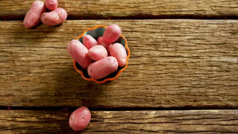 sweet potatoes on wooden table 4k