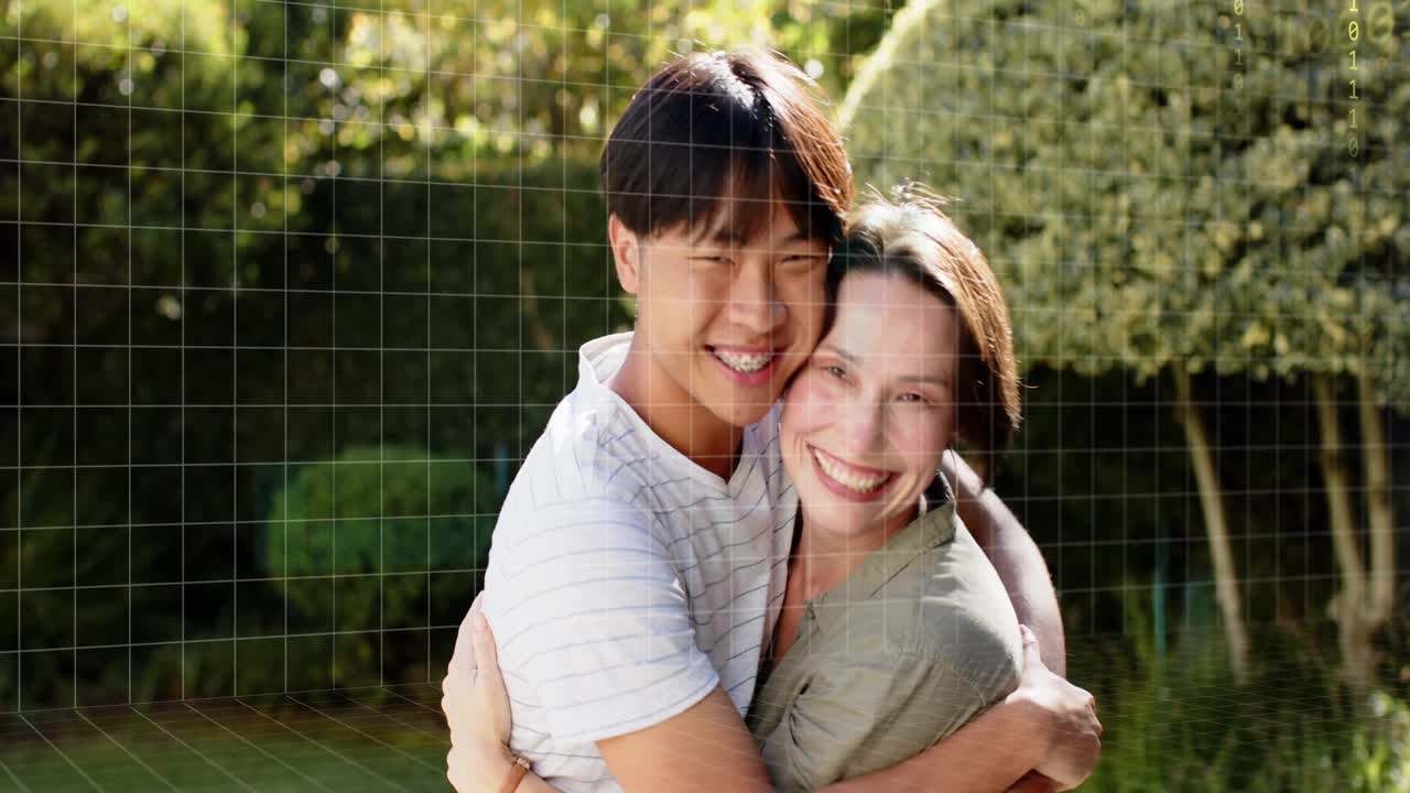 Man wrapping arms around woman causing grid and code fading, hugging for affection, showcasing tech