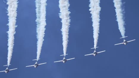 close up shot of formation of jet planes pulling up from a looping