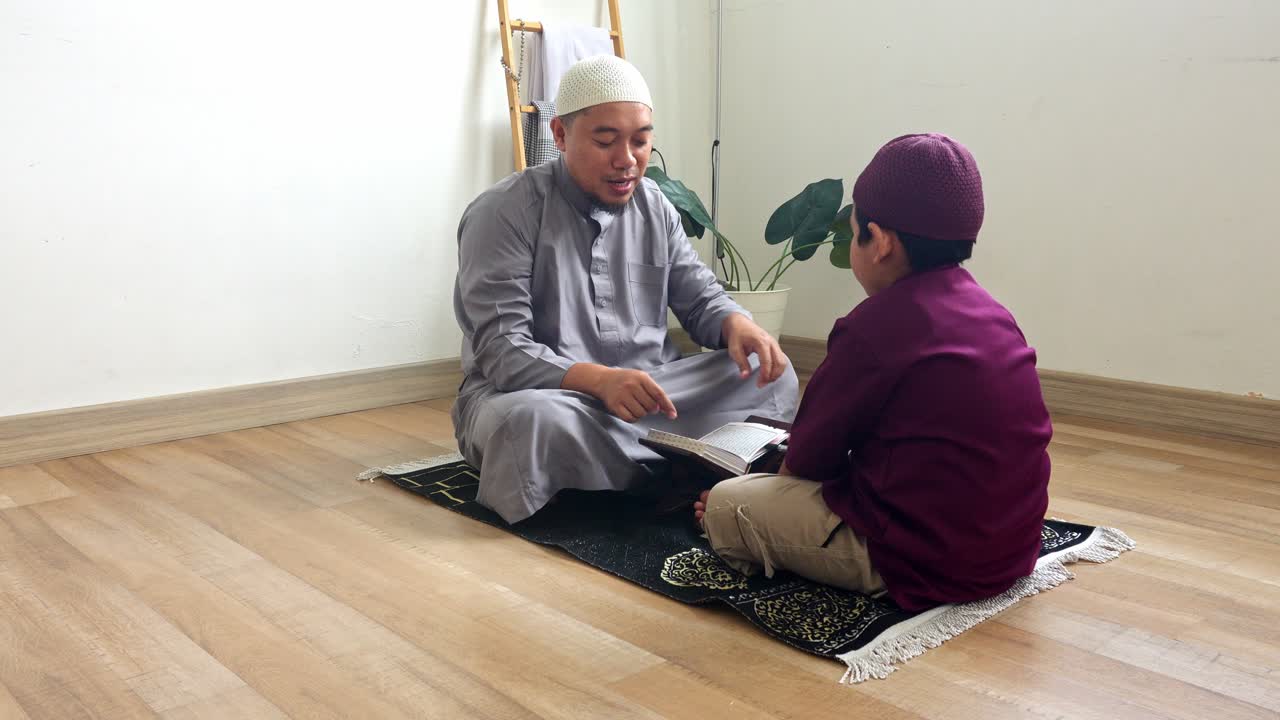 Portrait Of Indonesian Muslim Father Teaching His Son To Read The Quran
