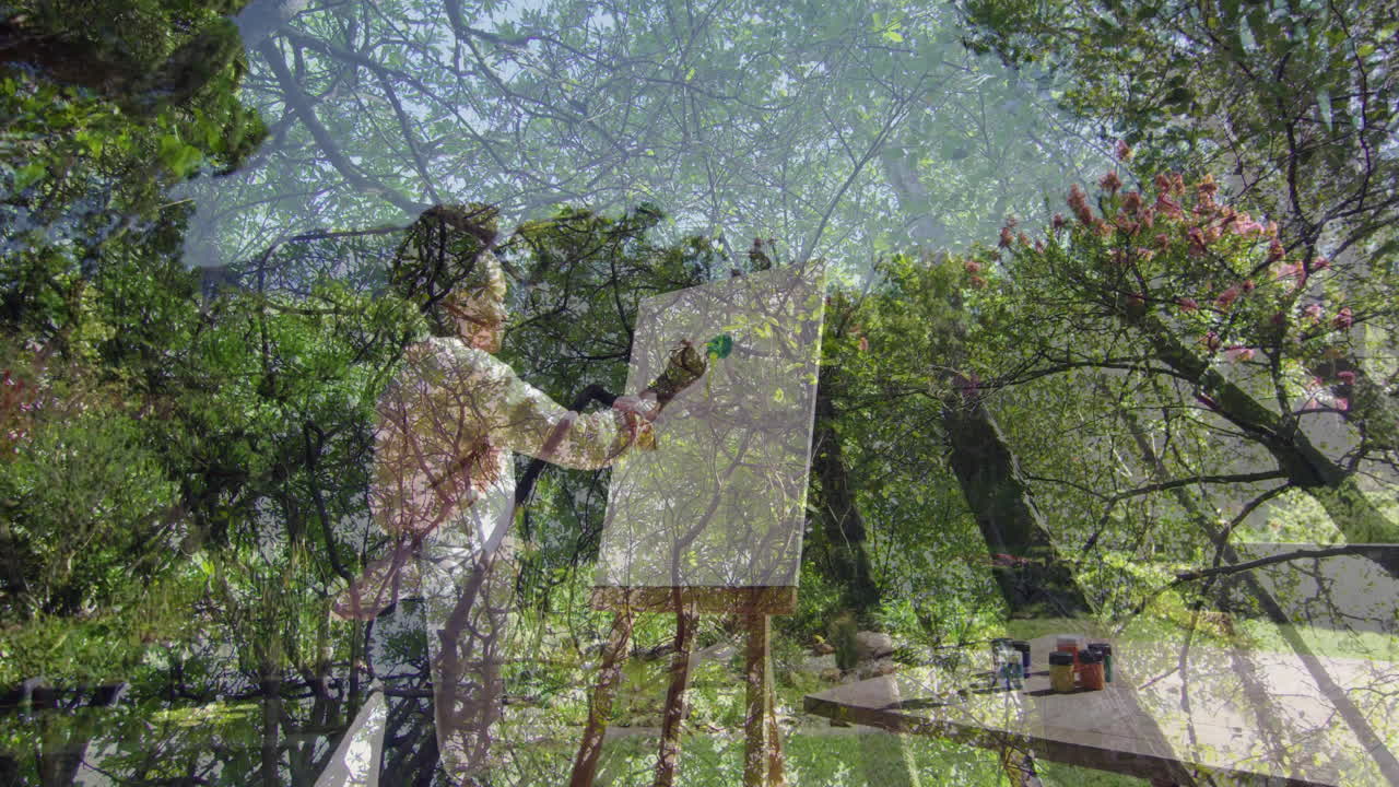 Painting on canvas, artist creating animation with lush green forest scenery
