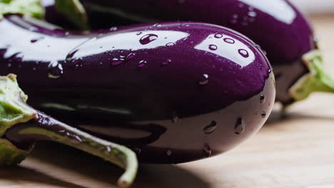 fresh purple eggplants with water droplets