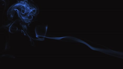 shot close up of vapouring smoke slowly flying on black background. close up. slow motion