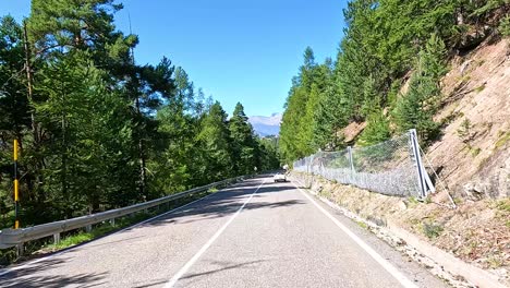 scenic drive through mountainous forest in piedmont, italy