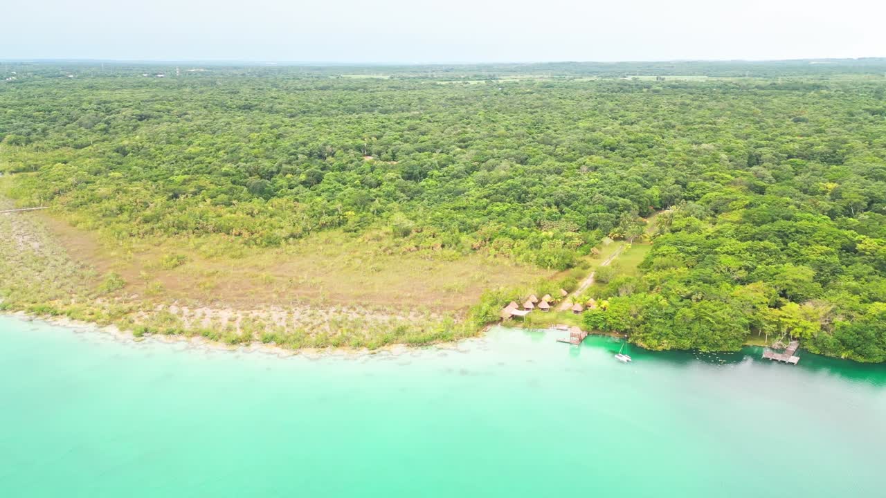 Tropical Forest Park With Huts And Natural Lazy River At Los Rápidos In The Bacalar Lagoon In Quintana Roo, Mexico. Aerial Drone Shot