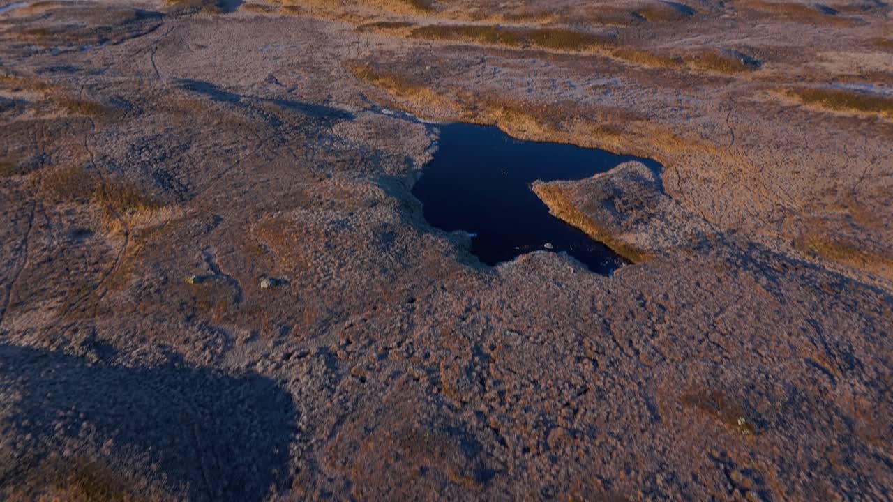 Aerial revealing shot of the Black Mount munros covered in snow at Rannoch Moor