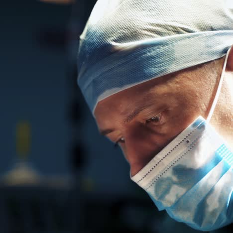 doctor in medical cap and mask. portrait of a professional male surgeon during operation process in the hospital. blepharoplasty surgery. close-up.