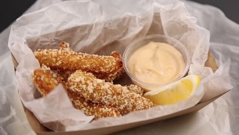 crispy fried food with sauce and lemon