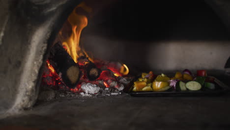 a pan with vegetables in it standing in the oven