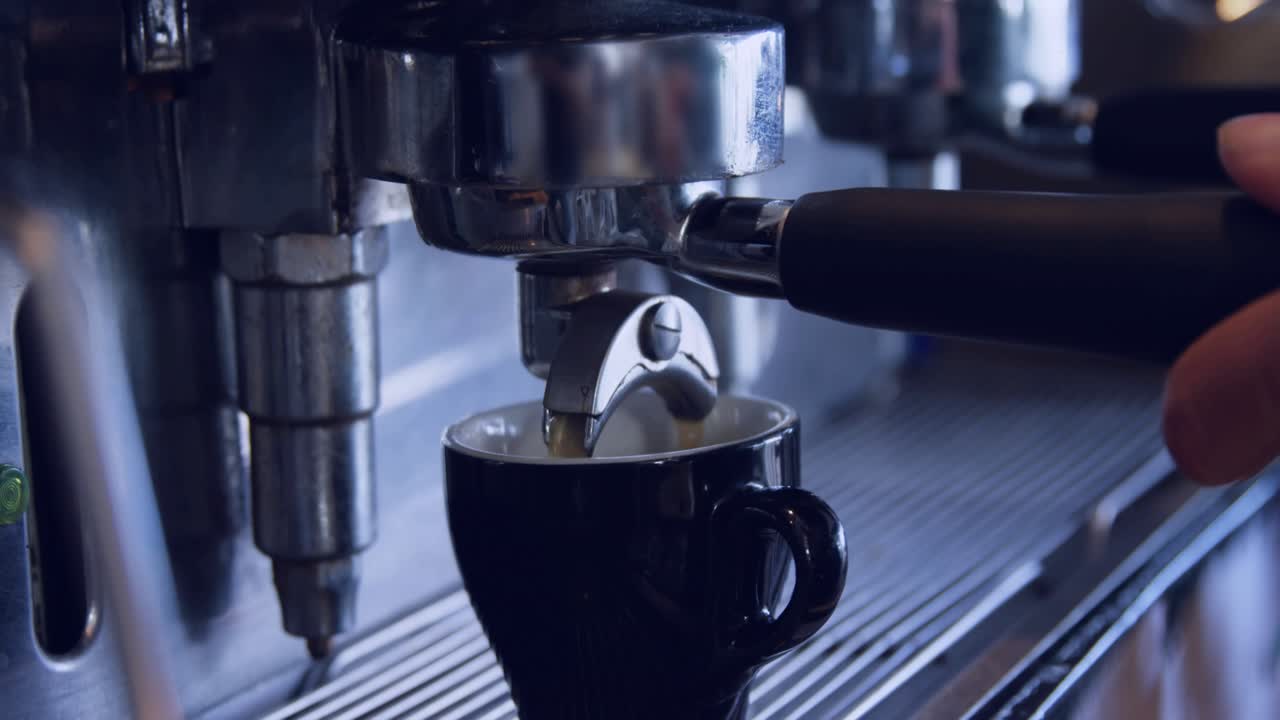 Espresso streaming into cup as data overlays animating barista twisting portafilter halting flow