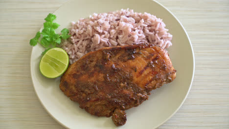 spicy grilled jamaican jerk chicken with rice - jamaican food style