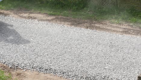 excavator carries gravel in the bucket