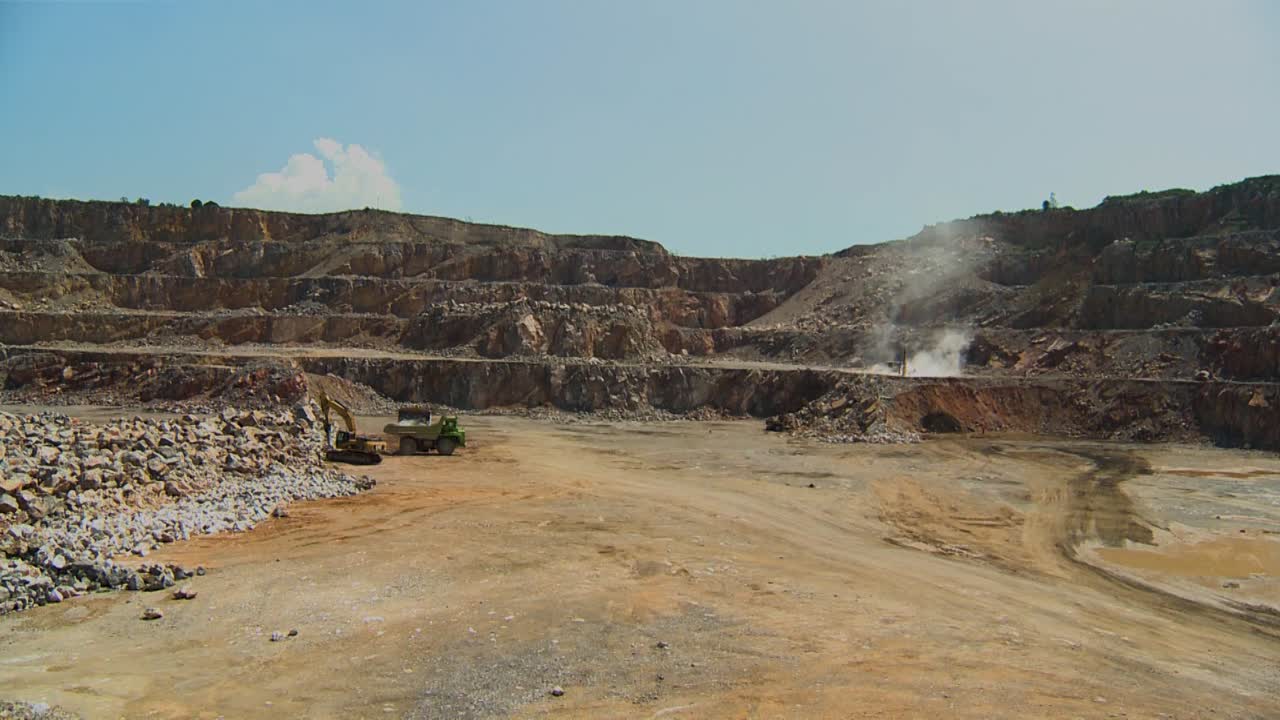Machinery working and loading rocks in a cement quarry in Hidalgo, Mexico