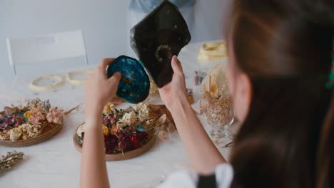 resin art project with dried flowers