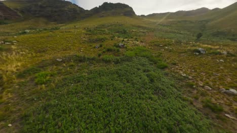 drone flying up the mountains at the du toits kloof valley near cape town