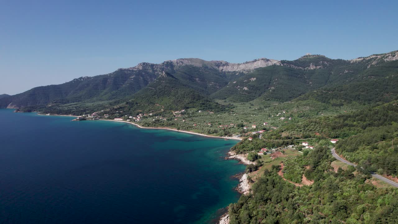 Aerial View Over Kinira View Point With High Mountain Peaks, Lush Green Vegetation, Mountain Road And Tropical Beaches In The Distance, Thassos Island, Greece