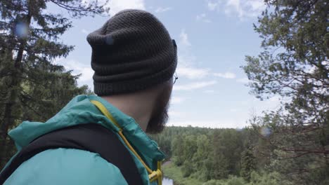 man hiking in a forest