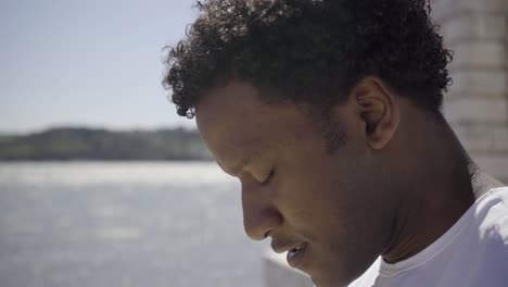 side view of african american man breathing heavy after training.